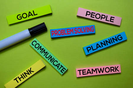 Problem Solving, Goal, People, Communicate, Planning, Think, Teamwork text on sticky notes isolated on green desk. Mechanism Strategy Conceptの写真素材