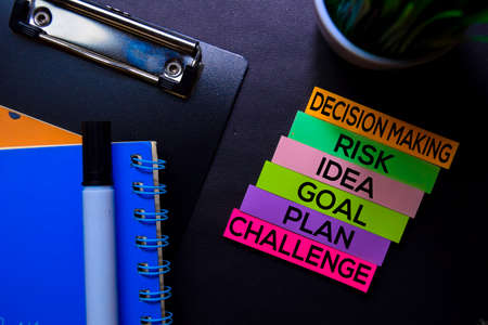 Decision Making, Risk, Idea, Goal, Plan, Challenge text on sticky notes isolated on Black desk. Mechanism Strategy Conceptの写真素材