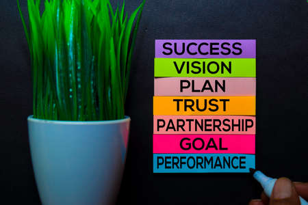 Success, Vision, Plan, Trust, Partnership, Goal, Performance text on sticky notes isolated on Black desk. Mechanism Strategy Conceptの写真素材