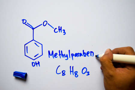 Methylparaben (C8,H8,O3) molecule written on the white board. Structural chemical formula. Education conceptの写真素材