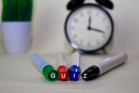 QUIZ text on color marker isolated on desk backgroundの写真素材
