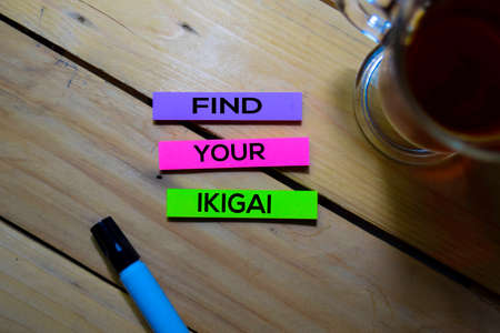 Find Your Ikigai text on sticky notes isolated on Table background. Japanese conceptの写真素材