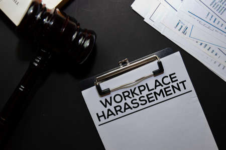 Workplace Harassement text on Document and gavel isolated on office desk. Law conceptの写真素材