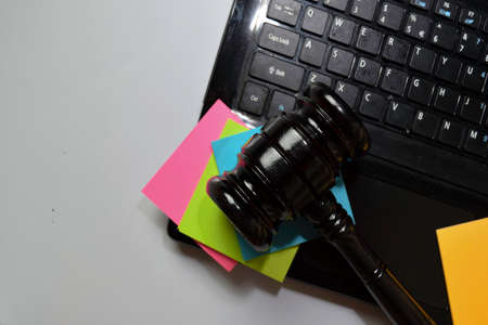 Keyboard Laptop and gavel isolated on office desk. Law concept