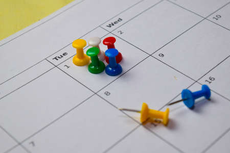 Close up Pinboard on white calendar. Schedule, reminder conceptの写真素材
