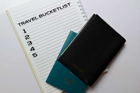 Passports and Travel Bucketlist write on a book isolated white background. holiday concept