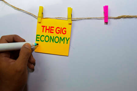 The Gig Economy isolated on white board background.の写真素材