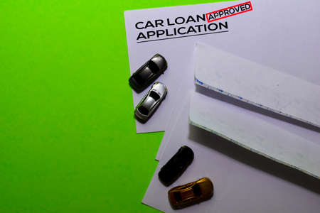 Car Loan Application in Approved with post card on office desk backgroundの写真素材
