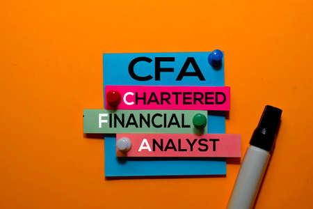 CFA. Chartered Financial Analyst acronym on sticky notes. Office desk backgroundの写真素材