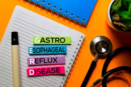 GERD. Gastro Esophageal Reflux Disease acronym on sticky notes. Office desk backgroundの写真素材