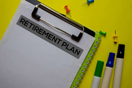 Retirement Plan on the Document with yellow background.の写真素材