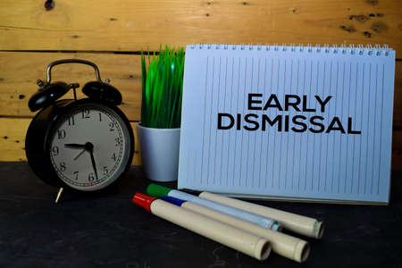 Early Dismissal write on book isolated Wooden background.の写真素材