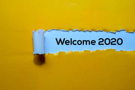 Close up Welcome 2020 written in yellow torn paperの写真素材