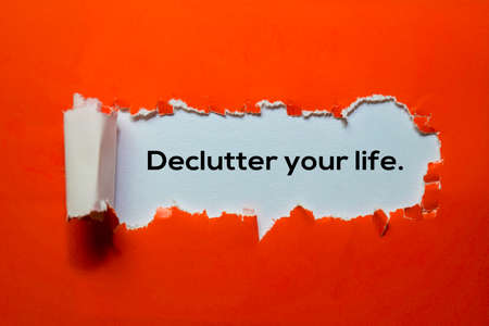 Close up Declutter Your Life written in red torn paperの写真素材