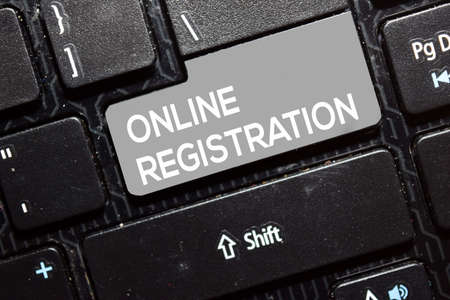 Online Registration write on keyboard isolated on laptop backgroundの写真素材