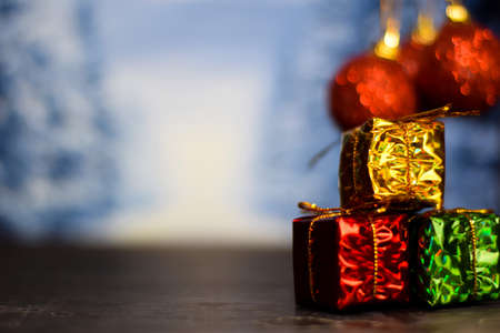 Close up decoration christmas gifts isolated on bokeh backgroundの写真素材