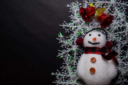 Decorative Christmas and snowman isolated on black backgroundの写真素材