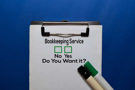 Bookkeeping Service, Do You Want it? Yes or No. On office desk backgroundの写真素材