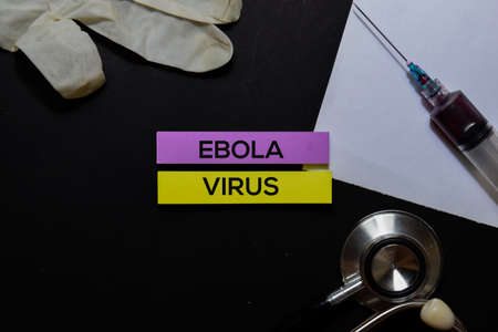 Ebola Virus text on Sticky Notes. Top view isolated on office desk. Healthcare/Medical conceptの写真素材