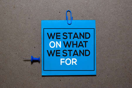 We Stand On What We Stand For write on sticky notes isolated on Office Deskの写真素材