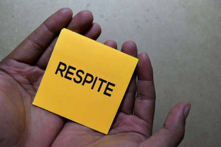 Respite write on sticky notes isolated on Office Deskの写真素材