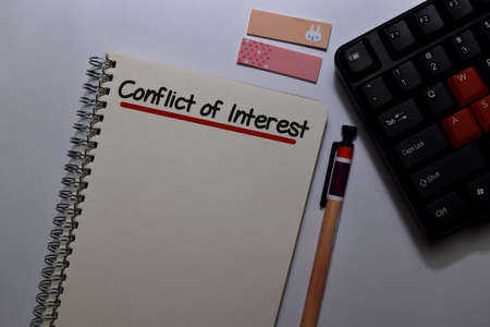 Conflict of Interest write on a book isolated on Office Deskの写真素材