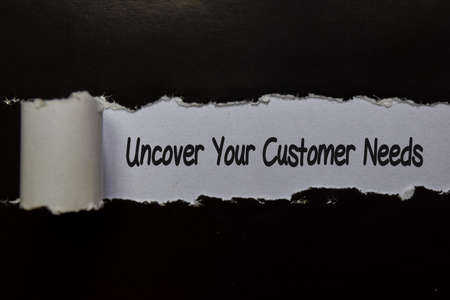 Uncover Your Customer Needs write on white and black torn paperの写真素材