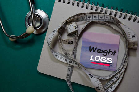 Weight Loss write on stick note isolated on Office Desk. Healthcare conceptの写真素材