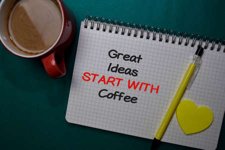 Great Ideas Start With Coffee write on a book isolated on Office Deskの写真素材
