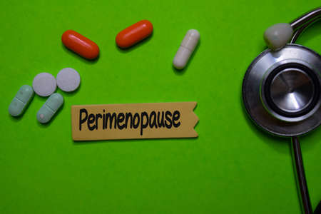 Perimenopause write on sticky note isolated on Office Desk. Healthcare or Medical Conceptの写真素材