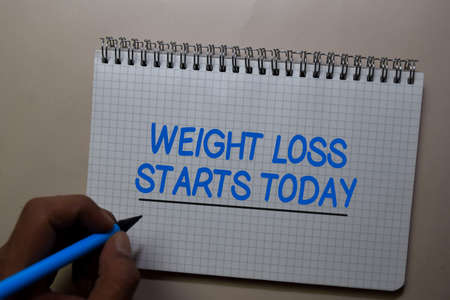 Weight Loss Starts Today write on a book isolated on Office Desk