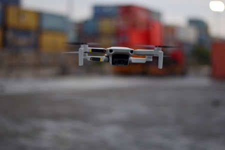 Close up Fly Grey Drone on Port Industrial Jakarta. selective focus on droneの写真素材