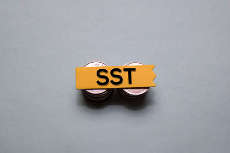 SST write on a sticky note isolated on office desk.