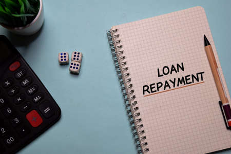 Loan Repayment write on a book isolated on office desk.の写真素材