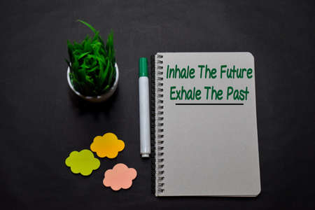 Inhale The Future. Exhale The Past write on a book isolated on office desk. Christian faith conceptの写真素材