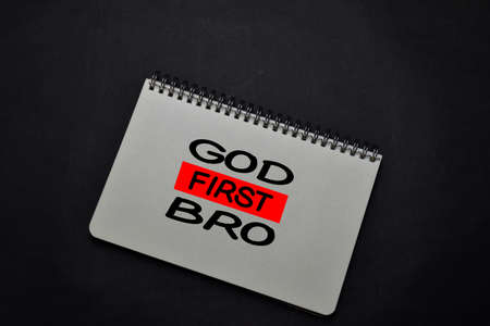 God First Bro write on a book isolated on office desk. Christian faith conceptの写真素材
