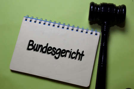 Bundesgericht write on a book with gavel isolated on Office Desk. German Language it means Supreme...