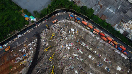 Aerial View. Large landfills like mountains. the tractor take garbage on landfills at Bekasi - Indonesiaの写真素材