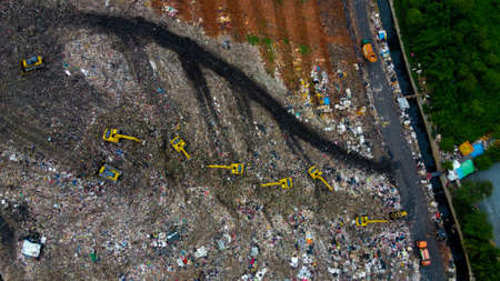 Aerial View. Large landfills like mountains. the tractor take garbage on landfills at Bekasi -...