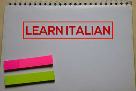 Learn Italian write on a book isolated on Office Desk