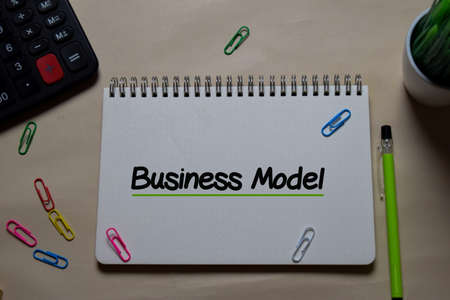 Business Model write on a book isolated on Office Desk