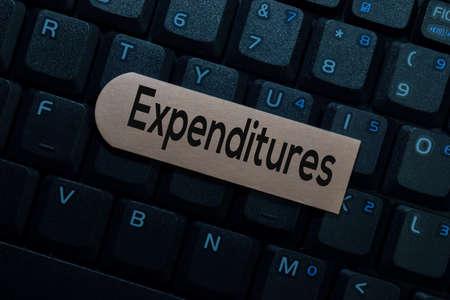 Expenditure isolated on laptop keyboard background