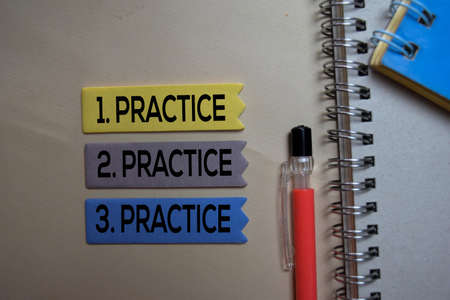 Practice. Practice. Practice text on sticky notes isolated on office deskの写真素材