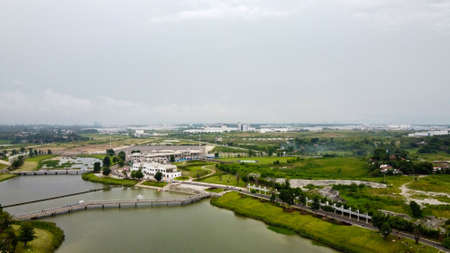 Bekasi, Indonesia, February 16 2020 : Aerial View or Drone Shot. Beautiful garden view and Green Lakeのeditorial素材