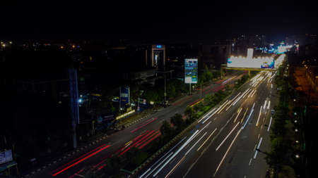 BEKASI. INDONESIA - FEBRUARY 23 2020: Aerial View. Light trails on motorway highway at night, long exposure abstract urban background at Bekasiのeditorial素材