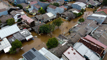 Aerial POV view Depiction of flooding. devastation wrought after massive natural disasters at Bekasi - Indonesiaの写真素材