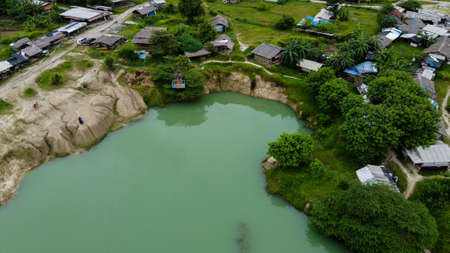 Aerial view beautiful green lake and surrounded by green grass