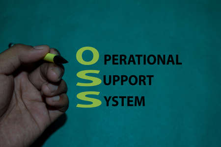 OSS - Operational Support System acronym text on Table Green Background