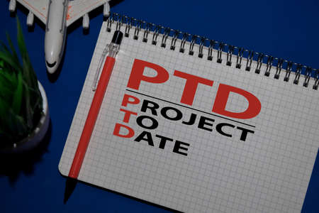 PTD - Project To Date acronym write on a book isolated on Office Desk.の写真素材