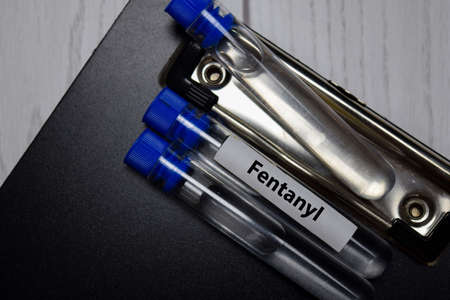 Fentanyl text on a bottle test. Top view isolated on office desk. Healthcare/Medical concept